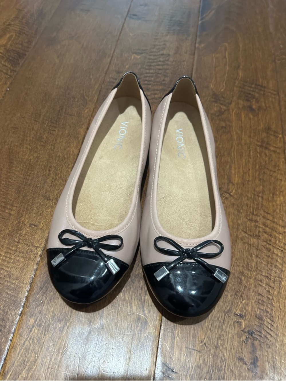 Vionic Spark Minna leather flats in blush with a black cap toe.